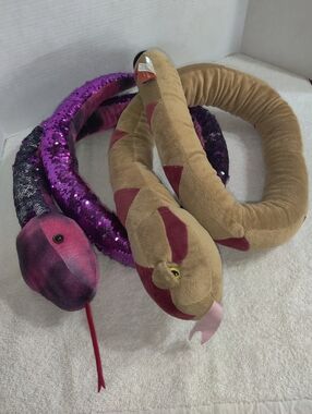 Set Of Two Adventure Planet Plush Toys.